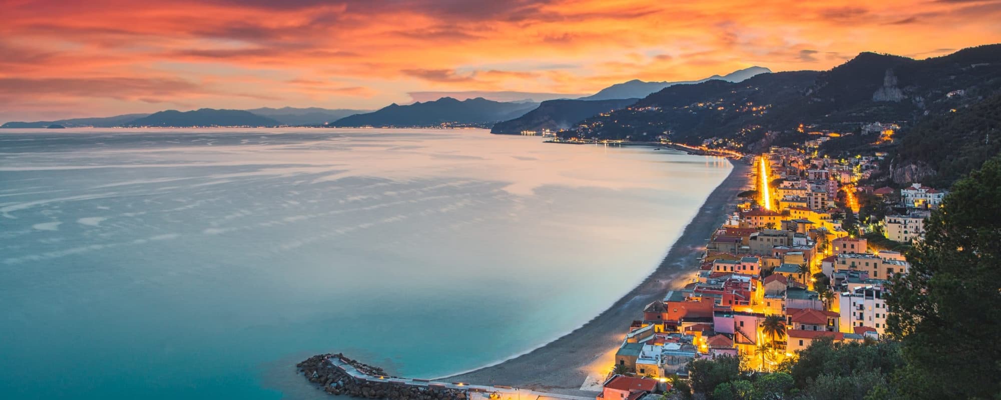 Aerial view of the beach of Varigotti during blue hour. Liguria, Italy.