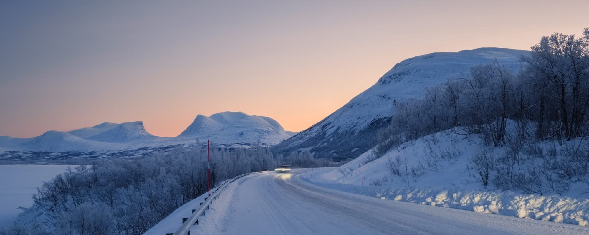 View at the road toward Abisko village in the northen part of Sweden. Landscape of arctic circle area in winter.